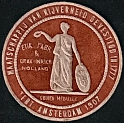 Sluitzegel Etik. Fabr. & Grav. Inrich Holland – Gouden Medaille Amsterdam 1907